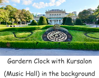 Gardern Clock with Kursalon (Music Hall) in the background